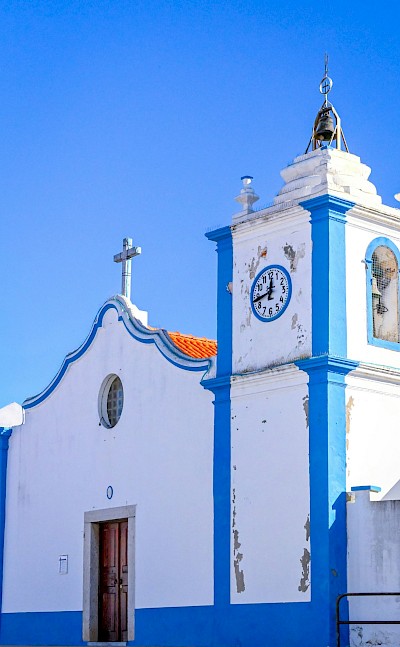 Blue and white church in Alentejo, Portugal. Unsplash@Stephan Holzinger