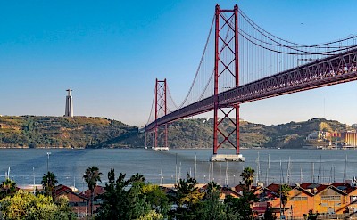 Blue skies over the 25 de Abril Bridge, Lisbon, Portugal. Unsplash@Svetlana Gumerova