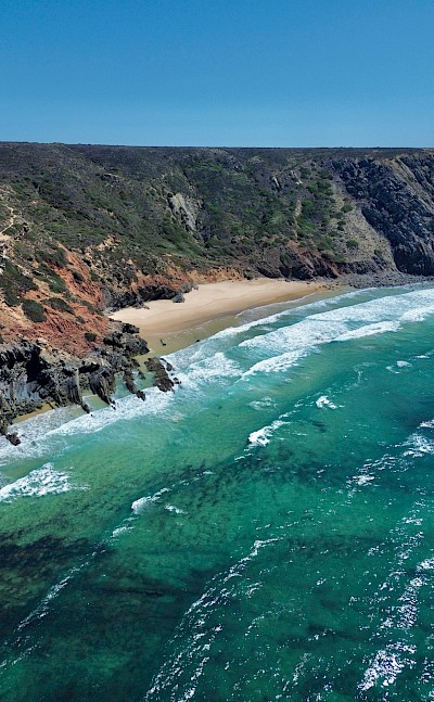 Red and black cliffs at Sagres, Portugal. Unsplash@Leon Rohrwild