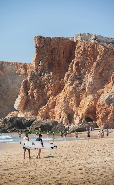 Surfers at Sagres, Portugal. Unsplash@Michael Baccin