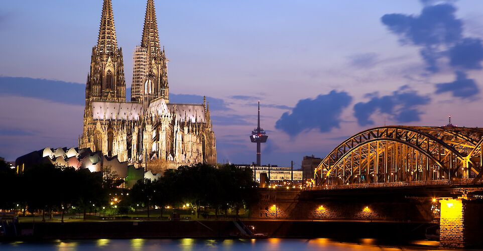 The famous Cathedral & Hohenzollern Bridge in Cologne, Germany. Flickr:Jiuguang Wang
