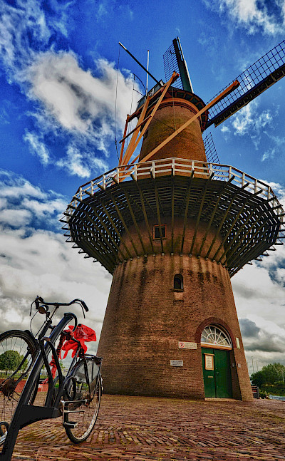 Bike rest at windmill in Rotterdam, South Holland, the Netherlands. Flickr:Luca Bolatti Guzzo