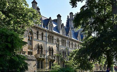 Leafy trees in front of Christ Church College, Oxford, England. Unsplash:Samuel Isaacs