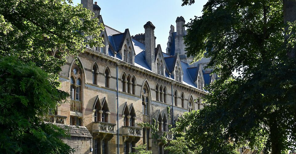 Leafy trees in front of Christ Church College, Oxford, England. Unsplash:Samuel Isaacs