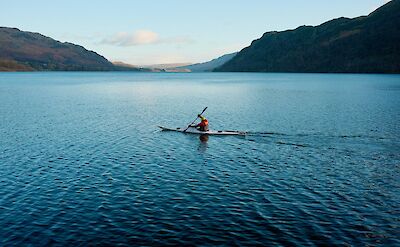 A kayaker on Ullswater Lake, Lake District, England. Unsplash:Ronan Laker