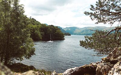 A yacht on Ullswater Lake, Lake District, England. Unsplash:Michael Hutchinson