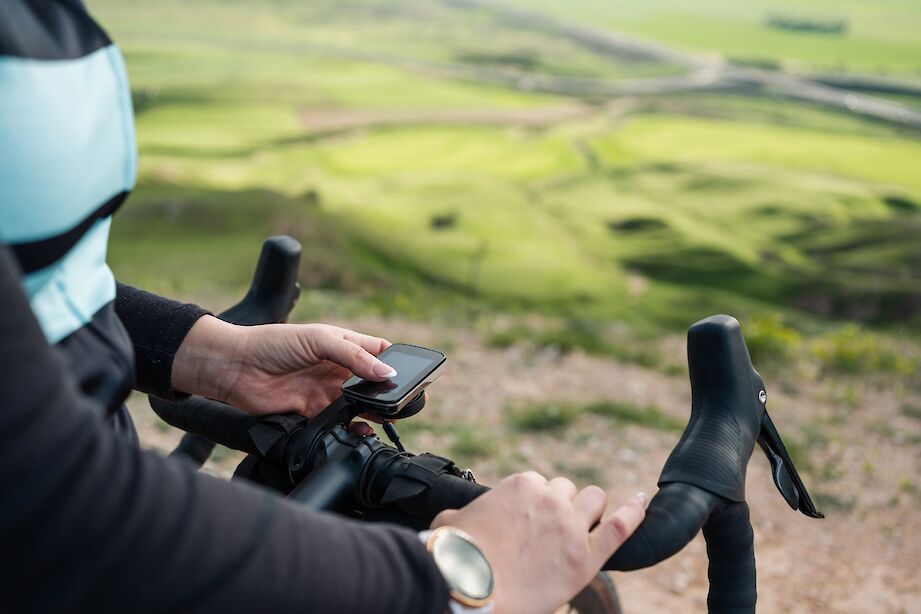 Using a GPS device on a bike tour. iStock@Jorge Aguado Martin