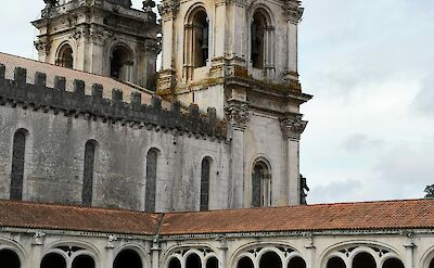 Arched cloisters of the Alcoba&ccedil;a Monastery in Portugal. Unsplash@Antonio Sessa