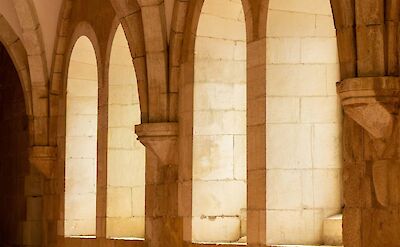 Sunlight through the arches of Alcoba&ccedil;a Monastery, Portugal. Unsplash@Luis Feliciano