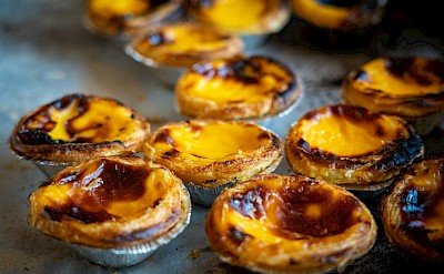 Freshly baked pasteis de nata. Unsplash@Nick Fewings