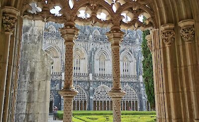 Intricate gothic stone archways of the Batalha Monastery in Portugal. Unsplash@Daiva Milisauskiene
