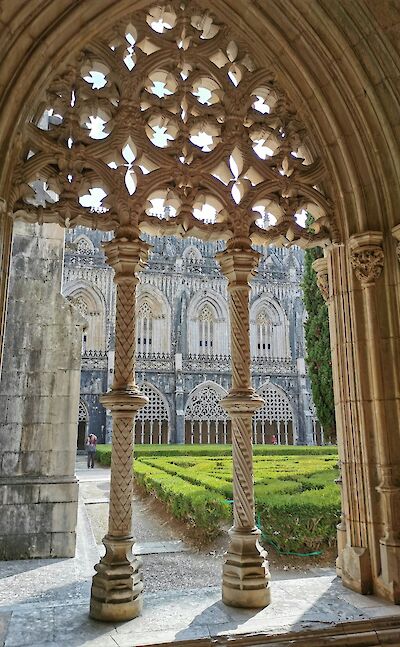 Intricate gothic stone archways of the Batalha Monastery in Portugal. Unsplash@Daiva Milisauskiene