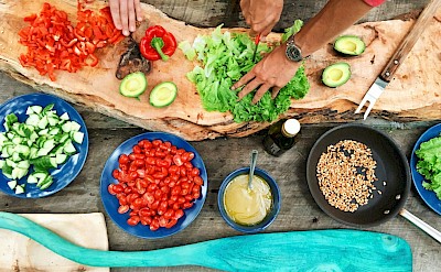 Preparing vegetables outside. Unsplash@Maarten van den Heuvel