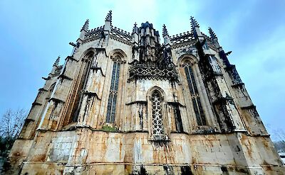 Ornate stone exterior of the Batalha Monastery in Portugal. Unsplash@Alejandro Pohlenz