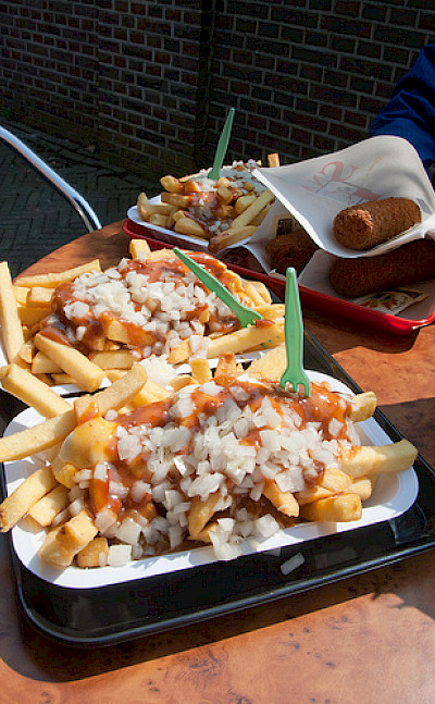 Dutch fries with curry ketchup, onions and "kroketten." Photo via Flickr:vitamindave