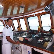 Captin on the bridge of the Beluga | Bike & Boat Tour