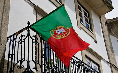 Flag of Portugal flying proudly over Valença, Portugal. Flickr:Mario Sanchez Prada
