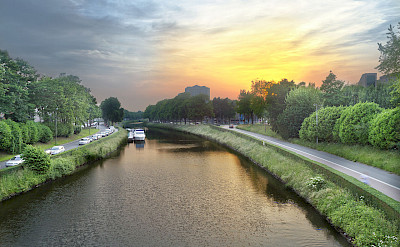 Biking along River Leie in Ghent, Belgium. Wikimedia Commons:Graham Richter