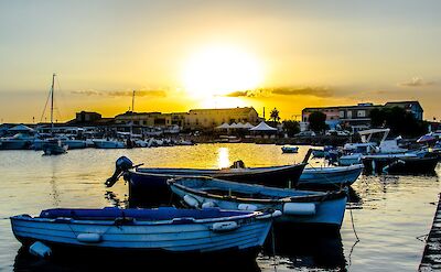 Sunset over the fishing boats in Marzamemi's historic harbor. Flickr:FrancescoCirigliano