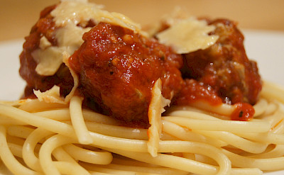 Meatballs and sauce over spaghetti