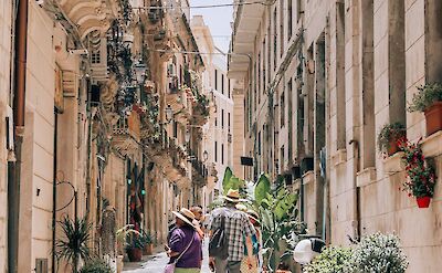 A charming lane lined with Baroque balconies in Syracuse. unsplash:YoavAzize9