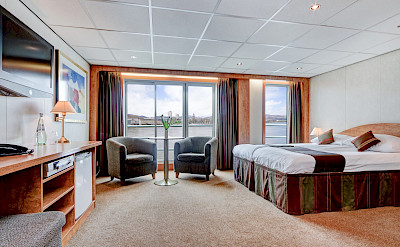 Upper Deck - Suite with French balcony and sofa | Fortuna | Bike & Boat Tours