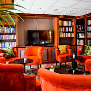 Library on board the Fortuna | Bike & Boat Tours
