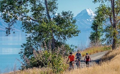 Cycling past beautiful lakes, New Zealand Alps. CC:TO