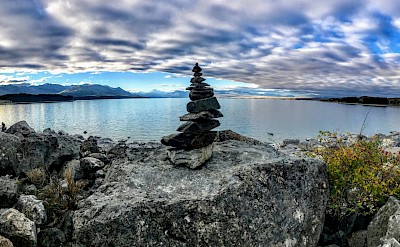 Pebble tower at Lake Ohau, New Zealand. Unsplash@Jose Mizrahi