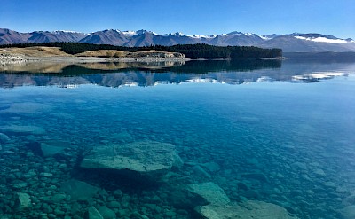 Translucent waters of Lake Ohau, New Zealand. Unsplash@Eyrie Photography