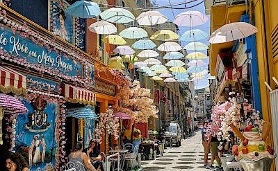 Umbrellas over a street in Athens, Greece. Unsplash@Marco Montero Pisani