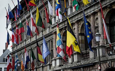 Flags on the parliament buildings in Antwerp, Flanders, Belgium. Flickr:Leonardo Angelini