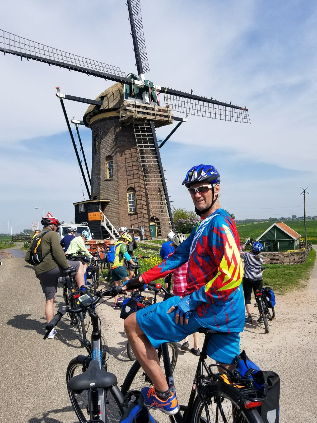 Posing in front of a windmill on our bike tour!