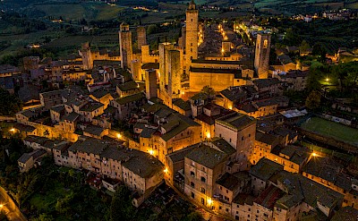The glow of lights from San Gimignano. pexels@gsntravel