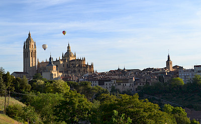 Hot air balloons at the Cathedral in Segovia on the on the Segovia Spain Hike Tour.