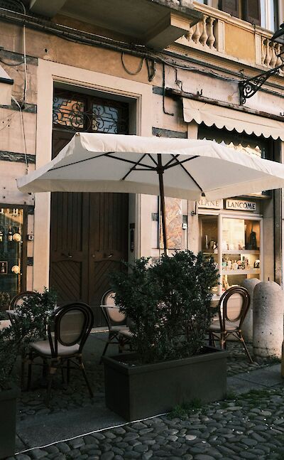 Cafe in Modena, Italy. Unsplash@Grigorii Shcheglov
