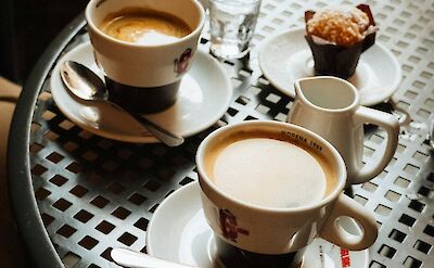 Coffee and muffins in Modena, Italy. Unsplash@Grigorii Shcheglov