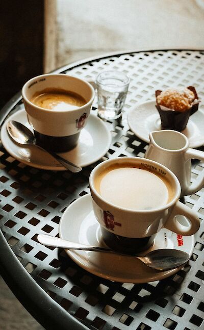 Coffee and muffins in Modena, Italy. Unsplash@Grigorii Shcheglov