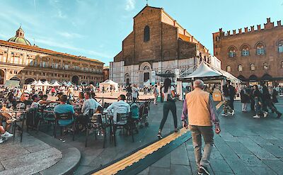 Eating in the square, Bologna, Italy. Unsplash@Khaled Bahar