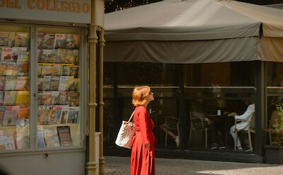 Lady admiring the architecture in Emilia-Romagna, Italy. Unsplash@Ekaterina Bogdan