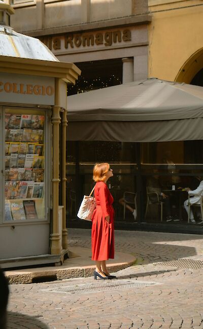 Lady admiring the architecture in Emilia-Romagna, Italy. Unsplash@Ekaterina Bogdan