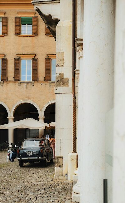 Old-fashioned car in Modena, Italy. Unsplash@Grigorii Shcheglov