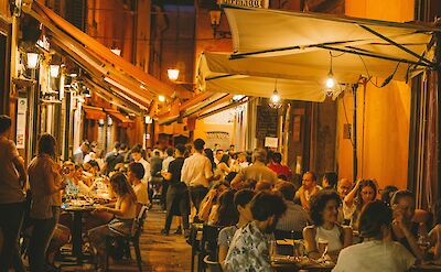 Restaurants in Bologna at night, Italy. Unsplash@Caroline Roose