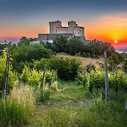 Flavors of Italy: The Very Best of Emilia-Romagna - Sunset at Torrechiara Castle, Emilia-Romagna, Italy. Unsplash@Samuele Bertoli