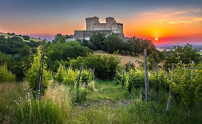 Sunset at Torrechiara Castle, Emilia-Romagna, Italy. Unsplash@Samuele Bertoli