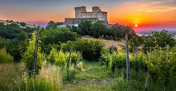Torrechiara Castle at sunset. unsplash@SamueleBertoli