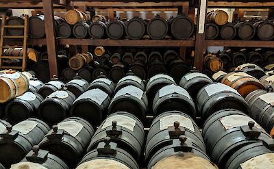 Wine barrels in Modena, Italy. Unsplash@Nik F