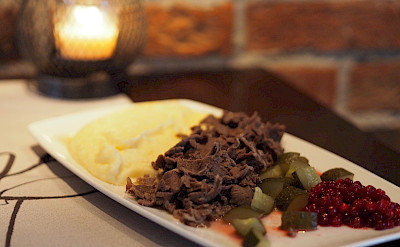 Traditional sauteed reindeer, mashed potatoes and lingon berries in Finland!