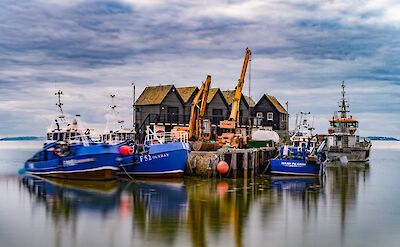 Boats in Whitstable, Kent, England. Unsplash:Zoltan Tasi