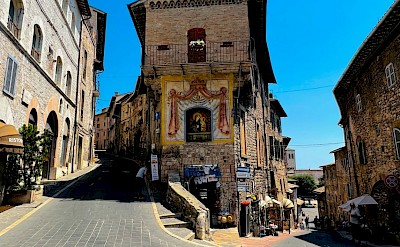Decorated building in Assisi, Italy. Unsplash@Itsatheerkh